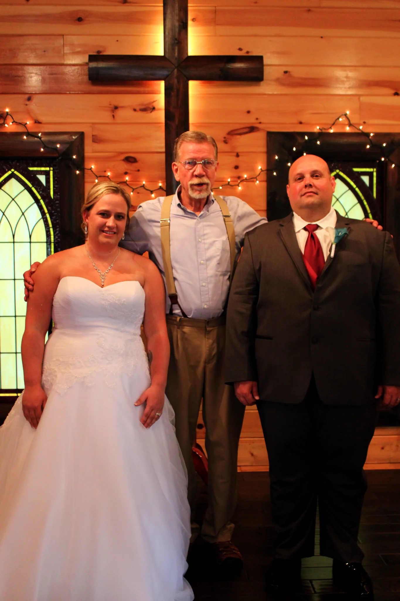 Rustic wedding chapel with wooden cross and stained glass at Moose Hollow Lodge in Pigeon Forge