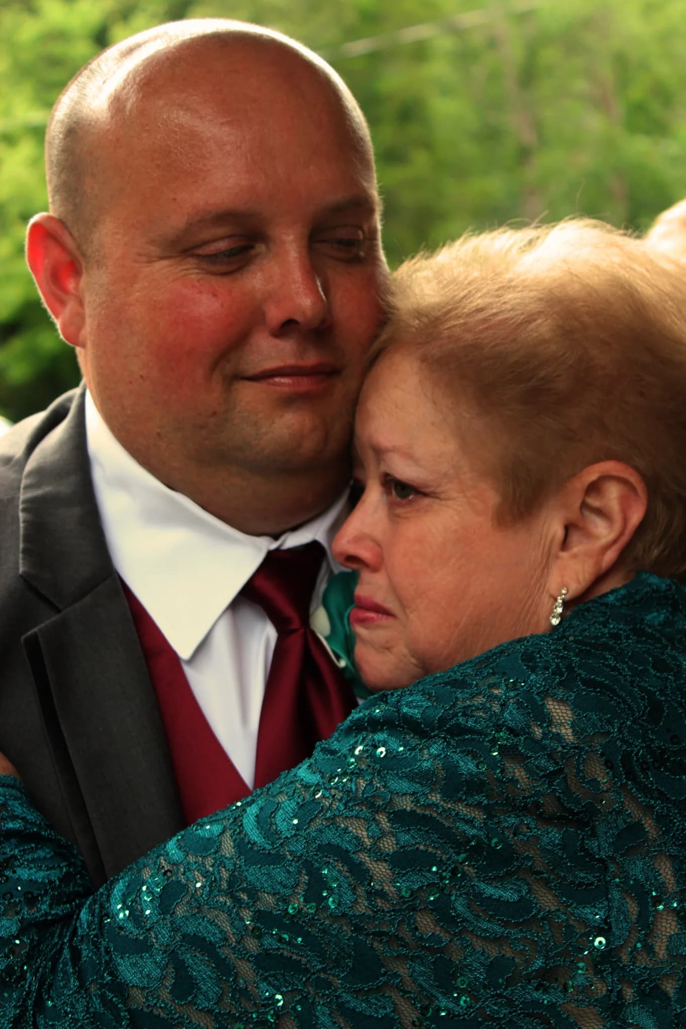 Emotional wedding embrace outdoors at Moose Hollow Lodge in Pigeon Forge near Dollywood in the Smoky Mountains