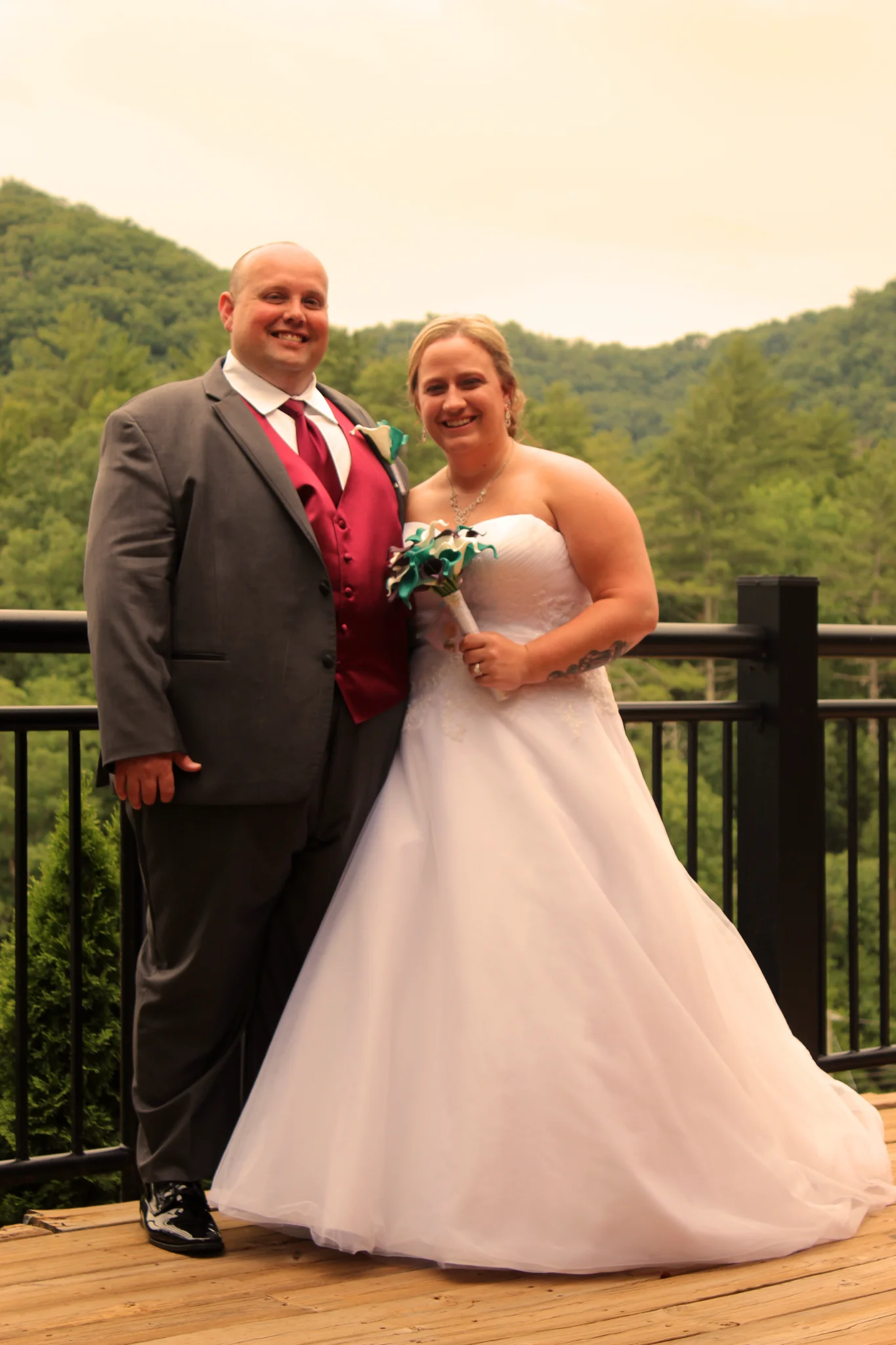 Wedding couple on scenic deck overlooking Smoky Mountains at Moose Hollow Lodge near Dollywood in Pigeon Forge