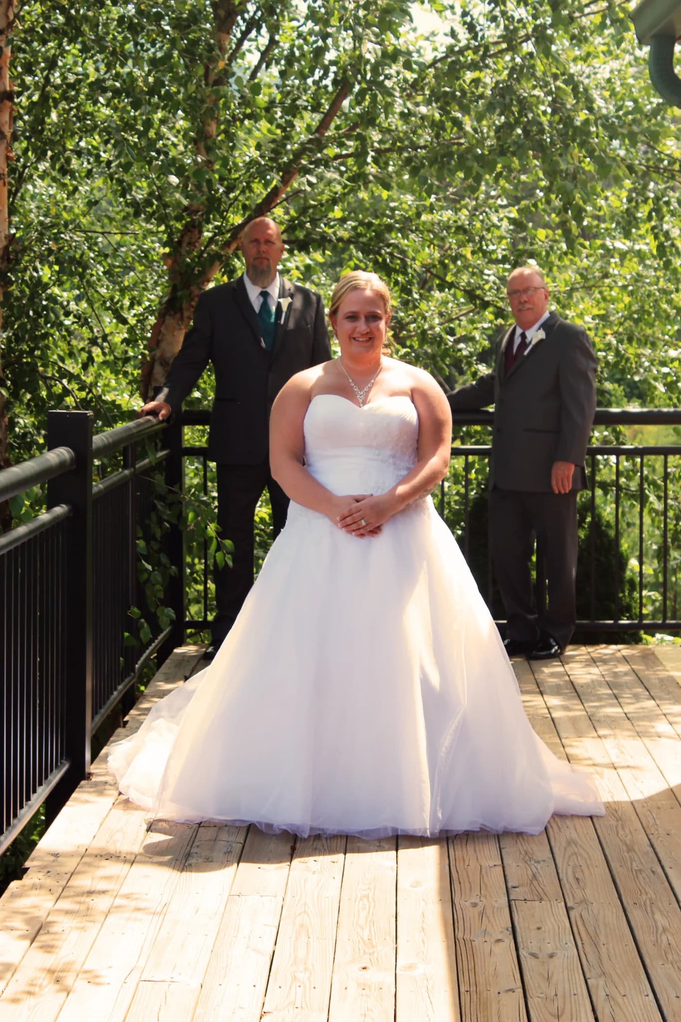 Bride on outdoor wedding deck with forest views at Moose Hollow Lodge near Dollywood in the Smoky Mountains