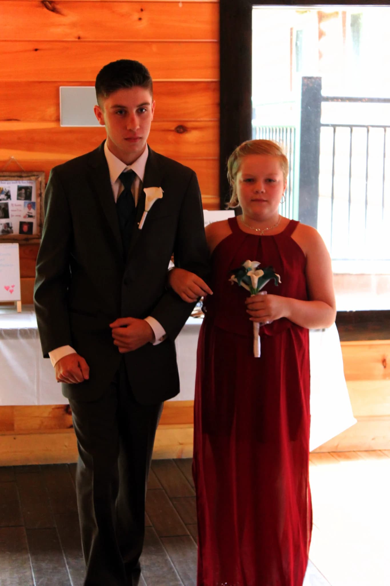 Wedding party walking in rustic log cabin interior at Moose Hollow Lodge in Pigeon Forge