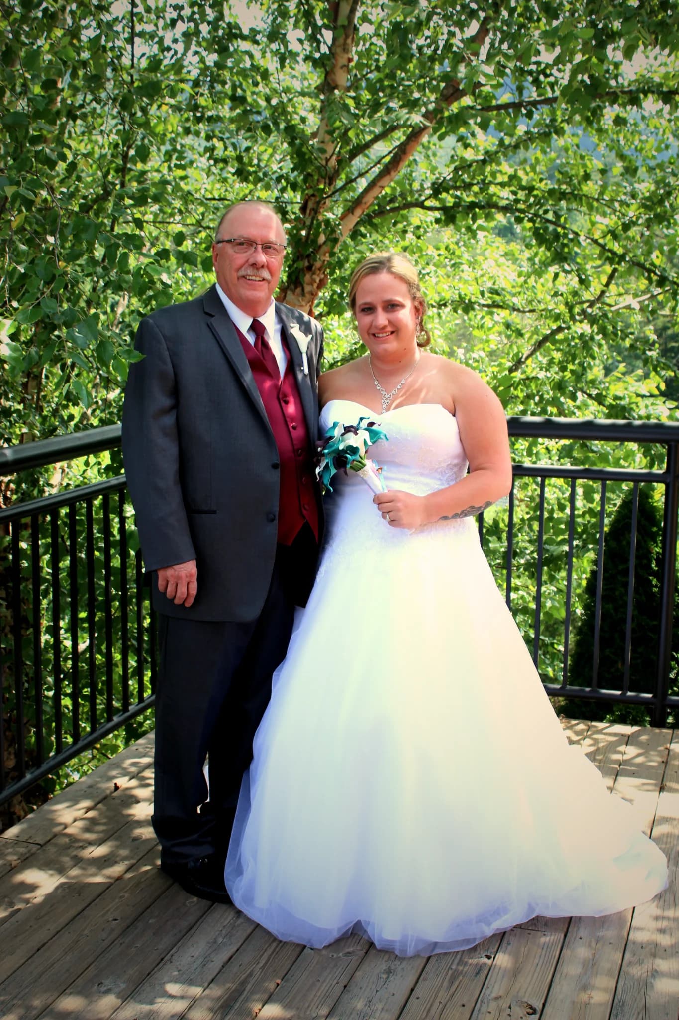 Wedding couple on scenic deck with forest views at Moose Hollow Lodge in Pigeon Forge near the Smoky Mountains