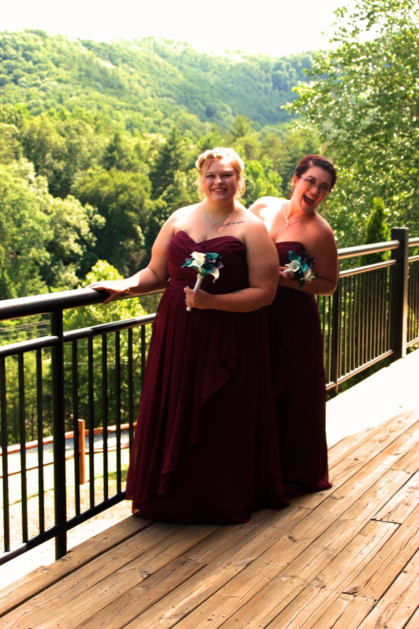 Bridesmaids in burgundy dresses on deck with Smoky Mountain views near Dollywood at Moose Hollow Lodge in Pigeon Forge