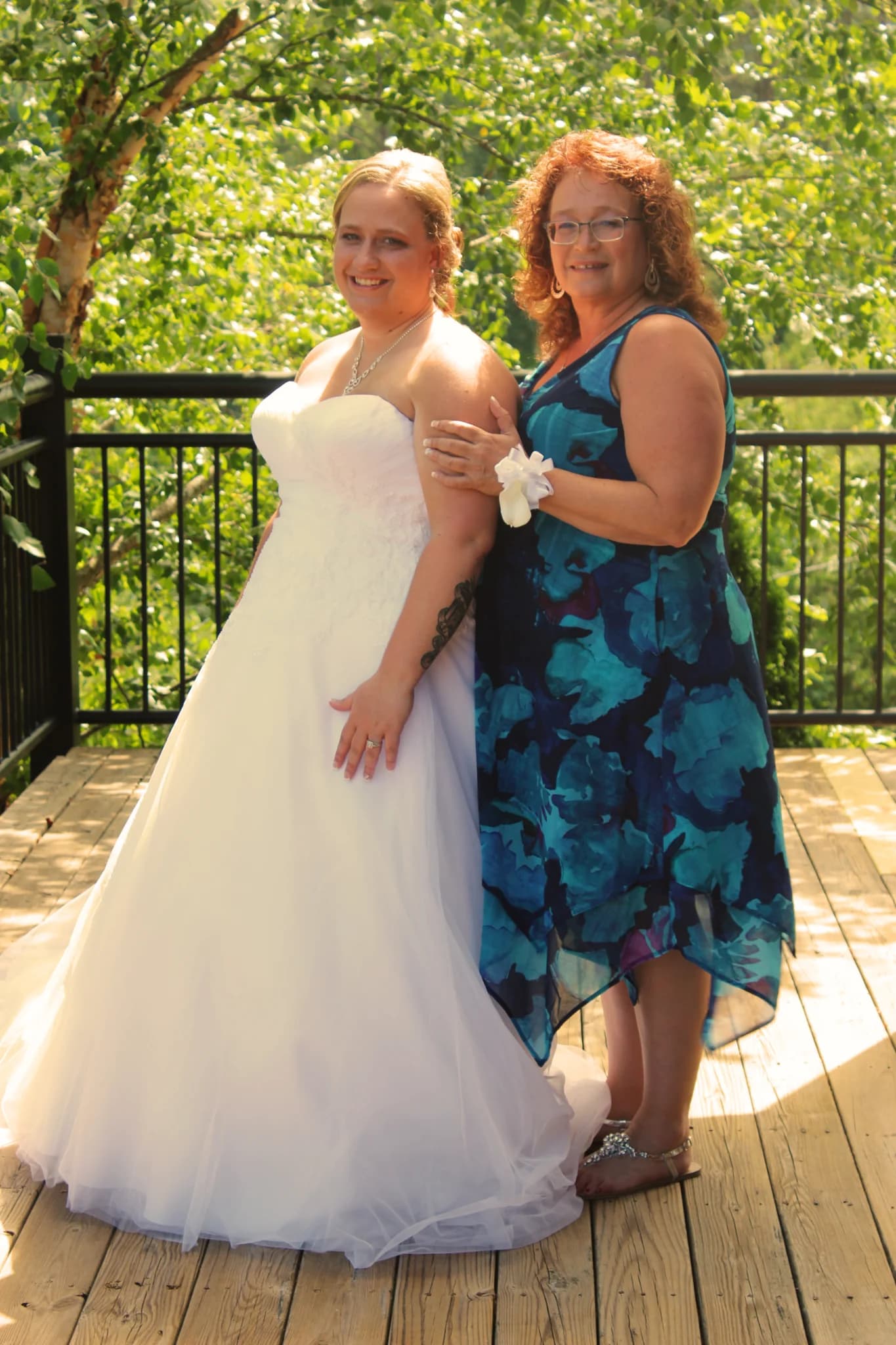 Bride posing on scenic outdoor deck with forest views near Dollywood at Moose Hollow Lodge in Pigeon Forge