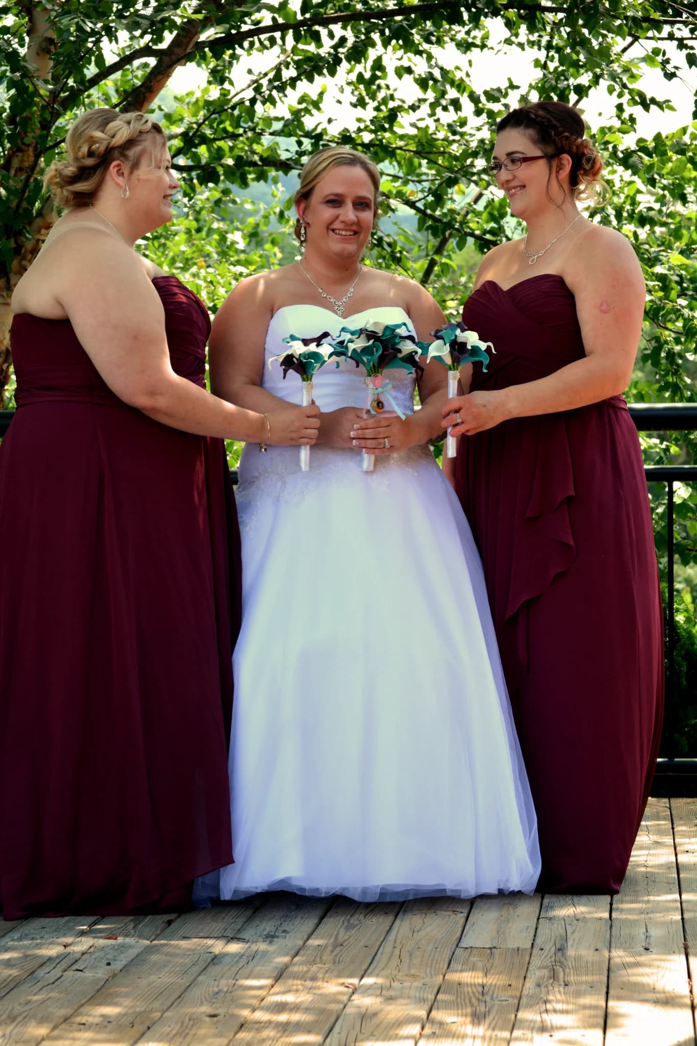 Bride and bridesmaids on a scenic wooden deck at Moose Hollow Lodge in Pigeon Forge near the Smoky Mountains