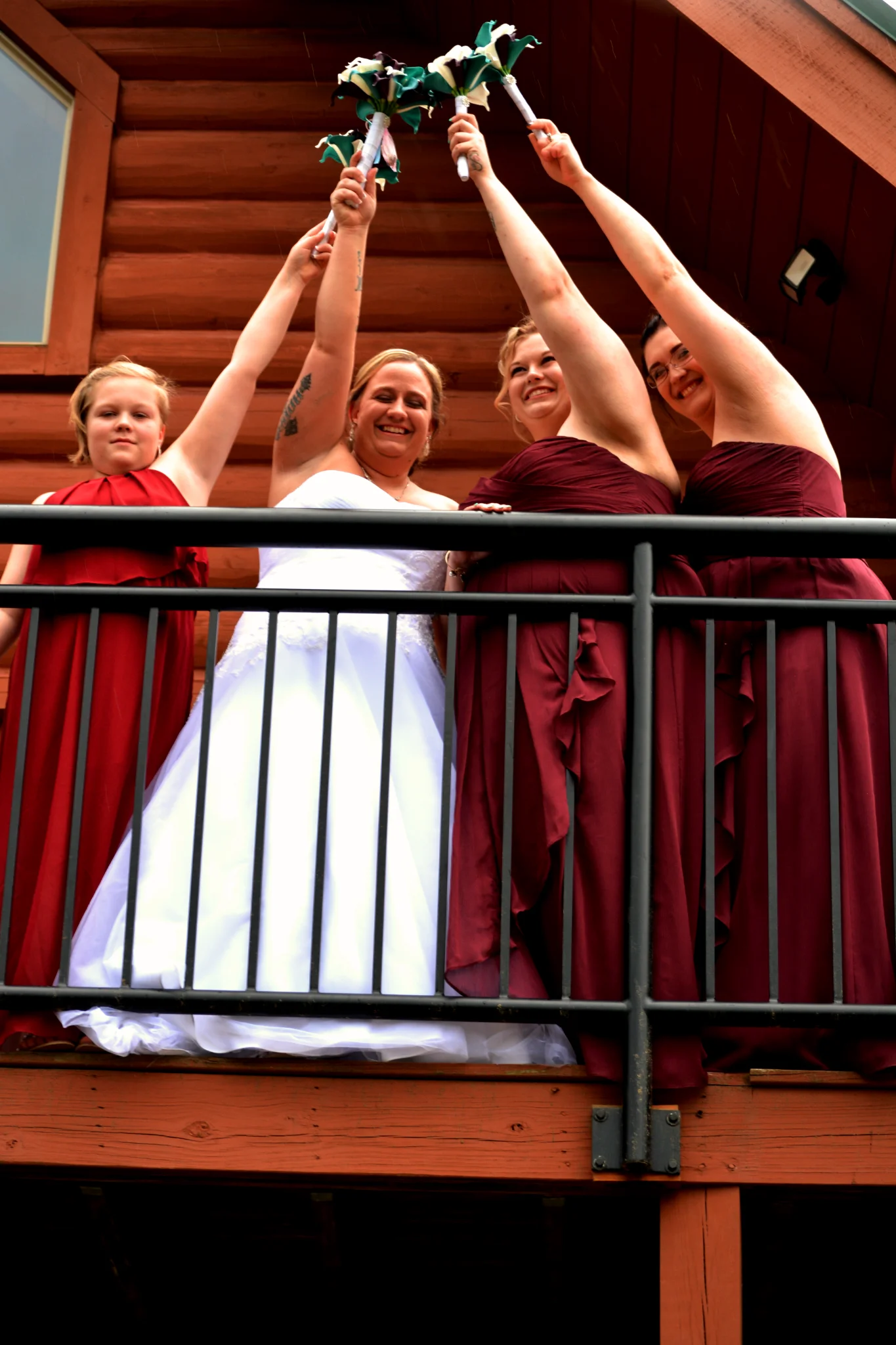 Bride and bridesmaids on a log cabin deck at Moose Hollow Lodge near Dollywood and the Smoky Mountains