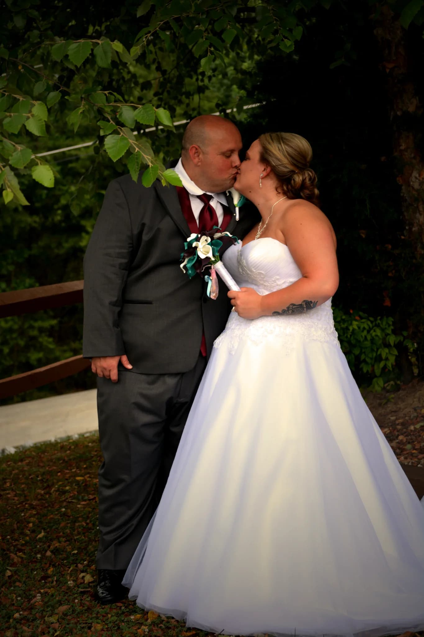 Bride and groom kissing outdoors at a wedding at Moose Hollow Lodge in Pigeon Forge near Smoky Mountains