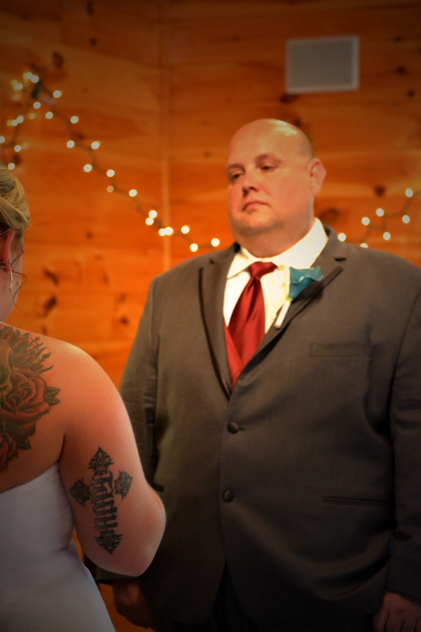 Rustic indoor wedding ceremony space with wood-paneled walls at Moose Hollow Lodge in Pigeon Forge