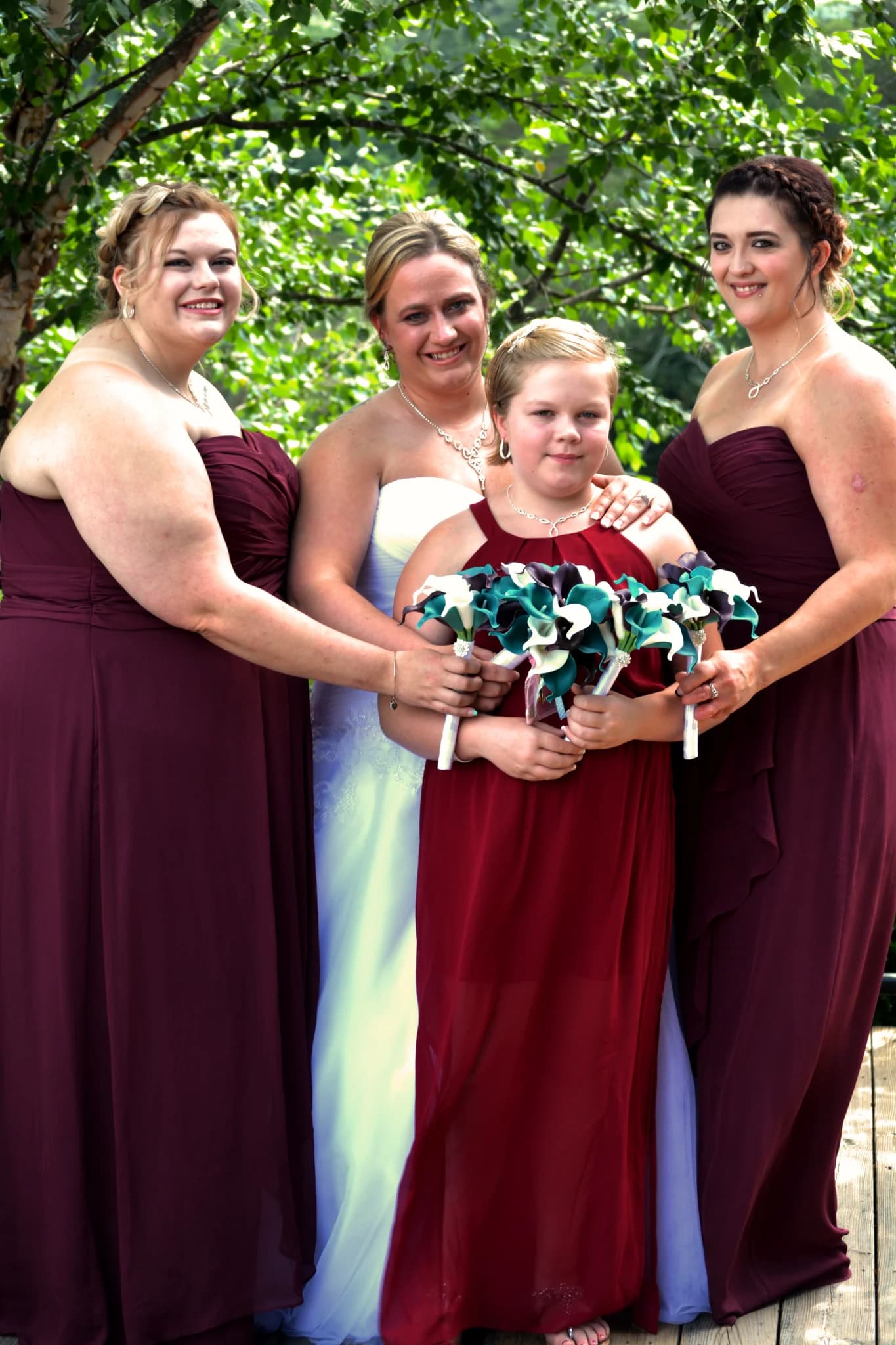 Bride and bridesmaids with bouquets on outdoor deck at Moose Hollow Lodge in Pigeon Forge near the Smoky Mountains