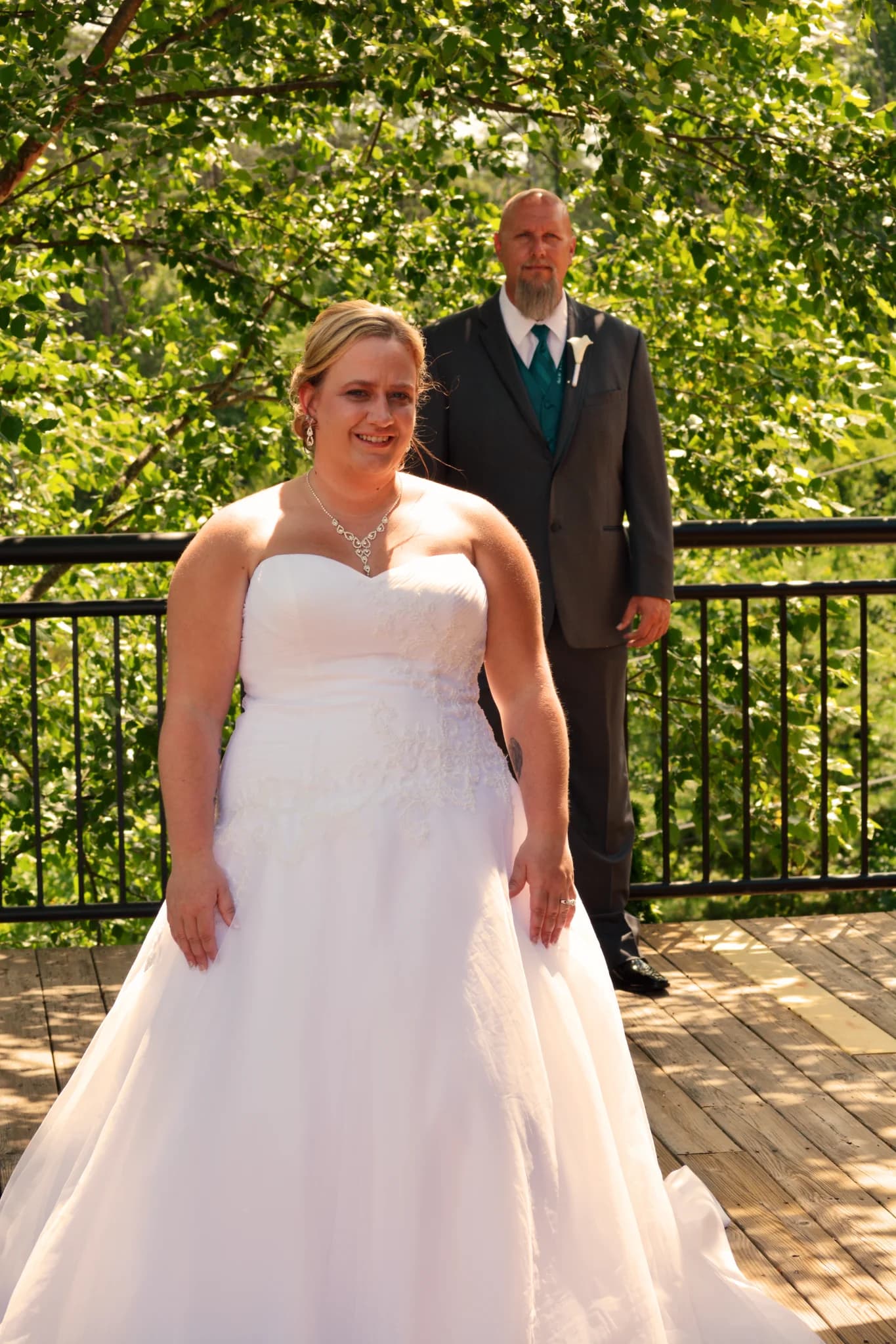 Bride and groom on scenic outdoor deck with forest view at Moose Hollow Lodge in Pigeon Forge near Dollywood