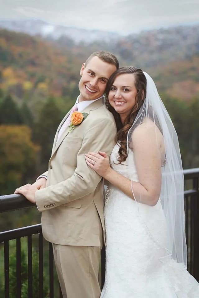 Wedding couple on a deck with autumn Smoky Mountain views at Moose Hollow Lodge in Pigeon Forge near Dollywood