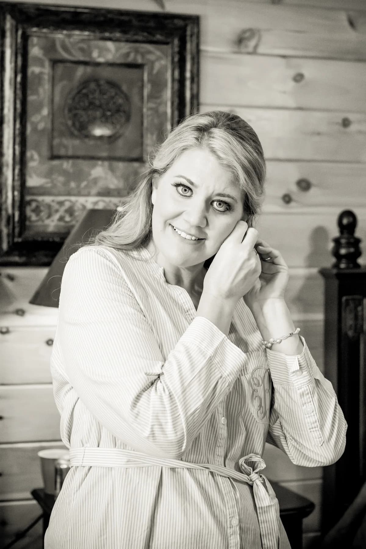 Bride getting ready in a rustic log cabin bedroom at Moose Hollow Lodge in Pigeon Forge