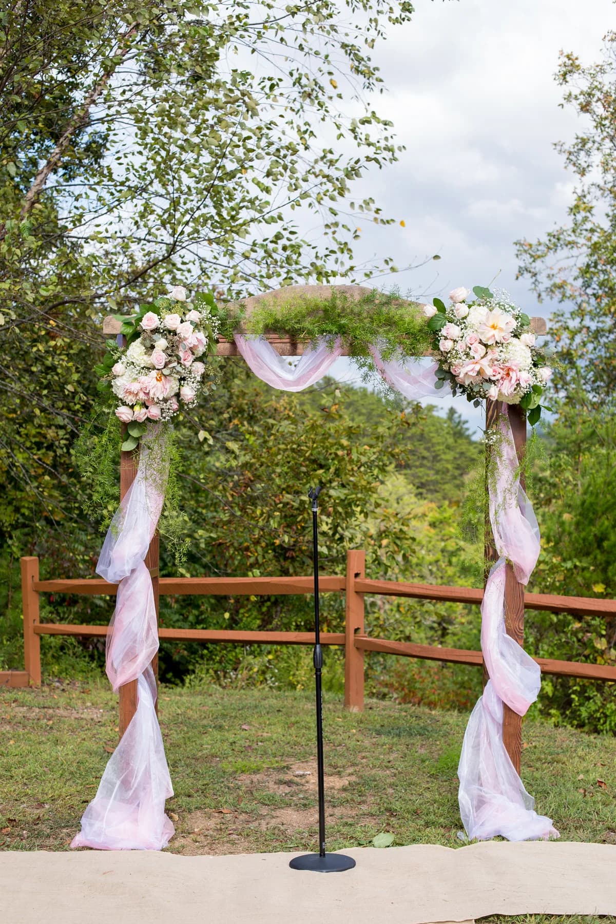 Outdoor floral wedding arbor with mountain views near Dollywood at Moose Hollow Lodge in Pigeon Forge