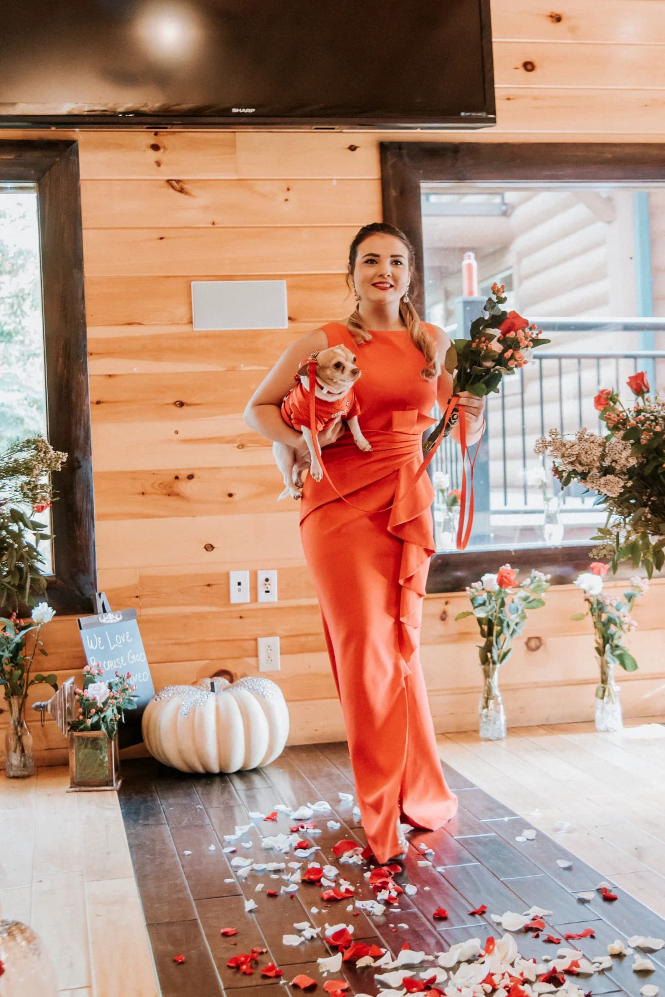 Rustic indoor wedding venue with petal-strewn aisle and wood walls at Moose Hollow Lodge in Pigeon Forge
