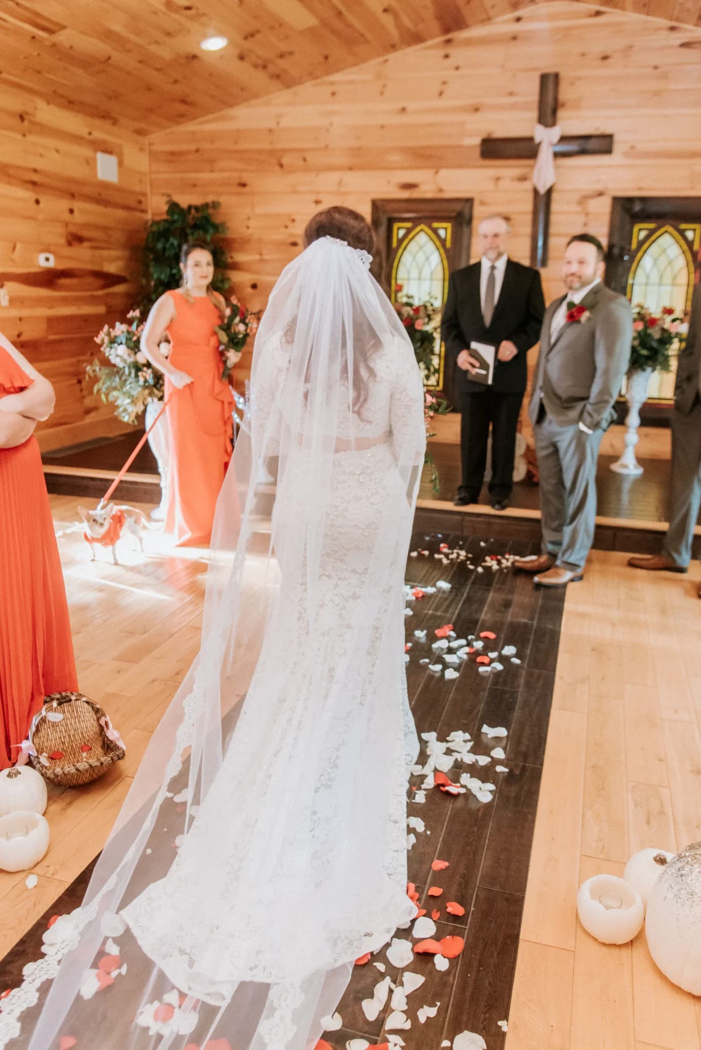 Rustic wedding chapel ceremony with bride in lace gown at Moose Hollow Lodge in Pigeon Forge