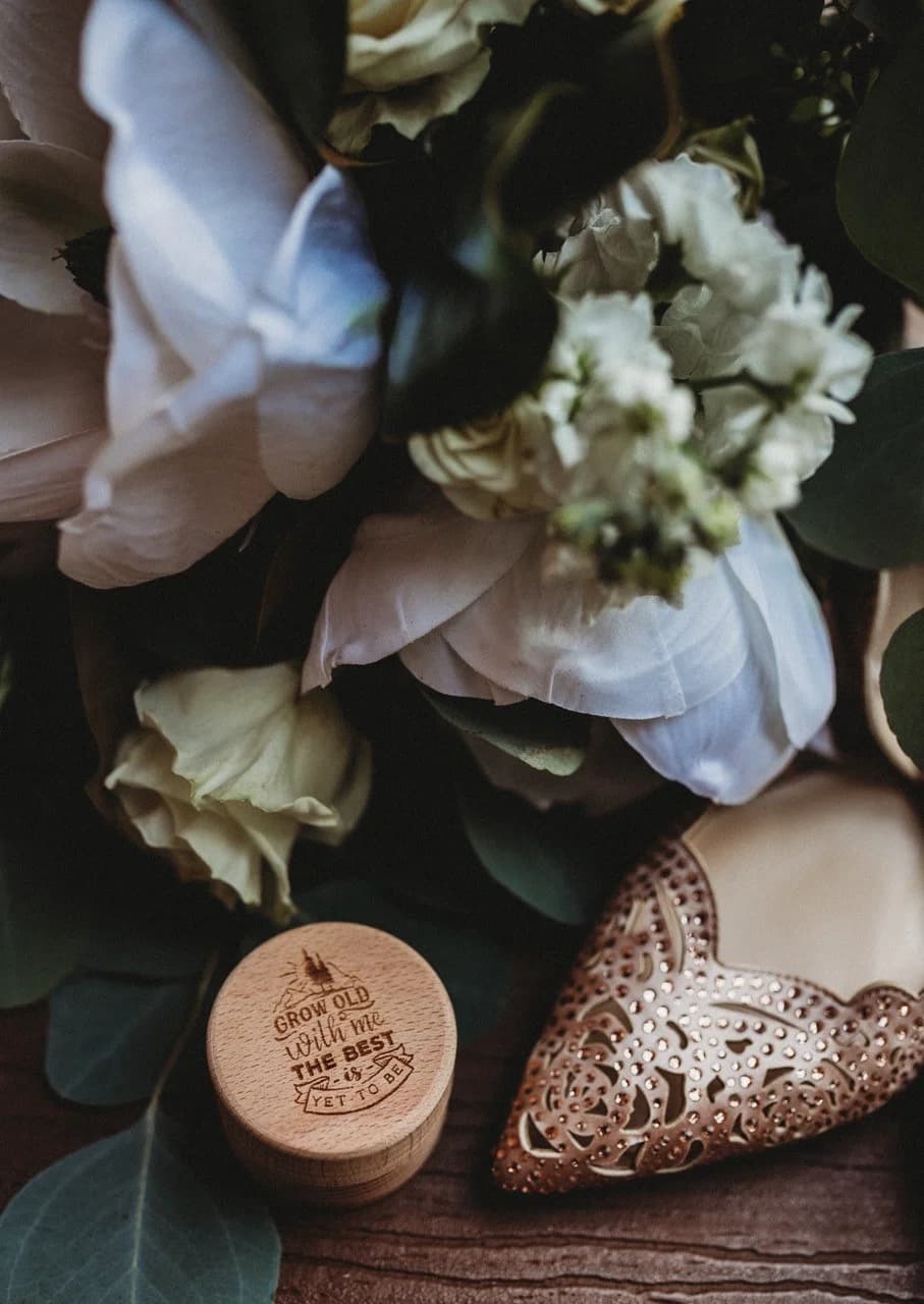 Wedding bouquet, jeweled bridal heels, and engraved ring box at Moose Hollow Lodge in Pigeon Forge