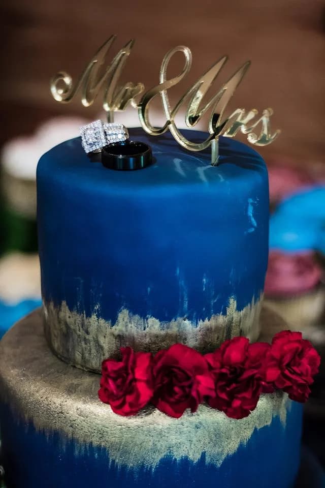 Navy and gold wedding cake with rings and Mr & Mrs topper at Moose Hollow Lodge in Pigeon Forge